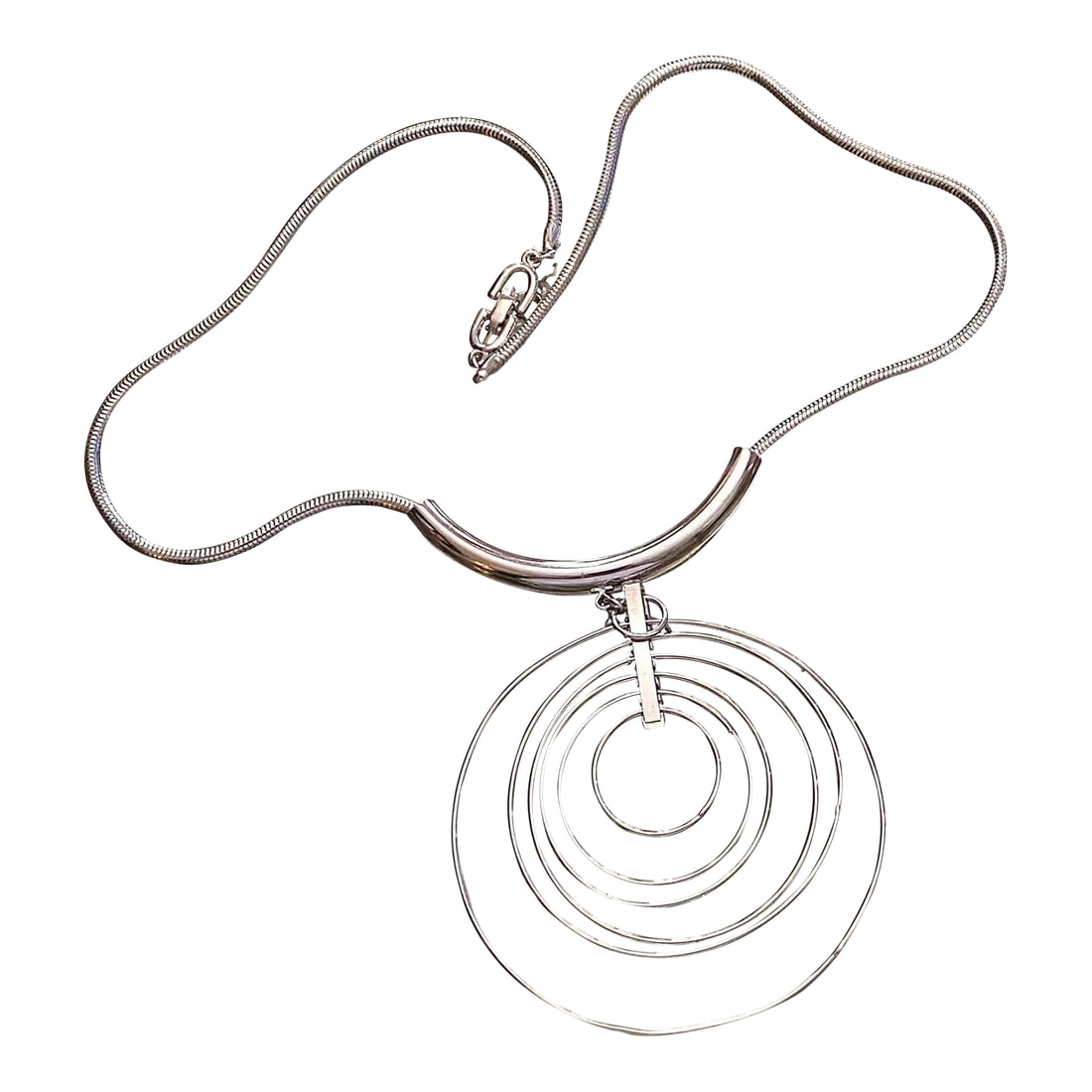 1970s Vintage Silver Mid Century Multi Disc Space Age Necklace: This is part of Chairish's Costume Jewelry assortment. Chic classic space age necklace in silver. Multi discs of varying sizes. Secure clasp. Total length including drop 14" No issues. Condition: