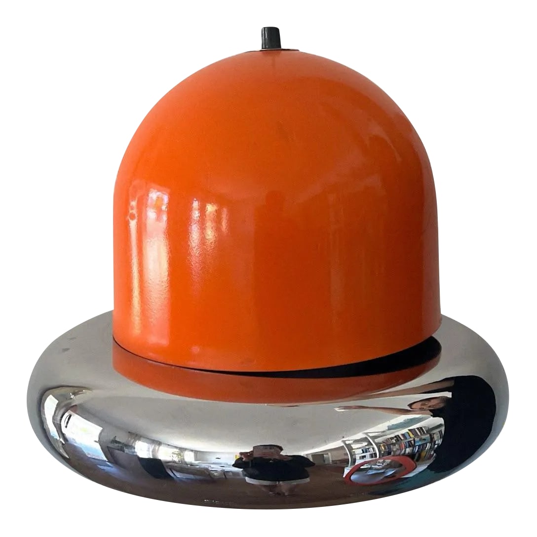 Space Age Pendant Lamp in the Style of Harvey Guzzini Dijkstra, 1960s: The space-age pendant attributed to Guzzini features an orange shade paired with a sleek aluminum or metal frame. This distinctive shade emits a magnificent glow, beautifully reflecting off the