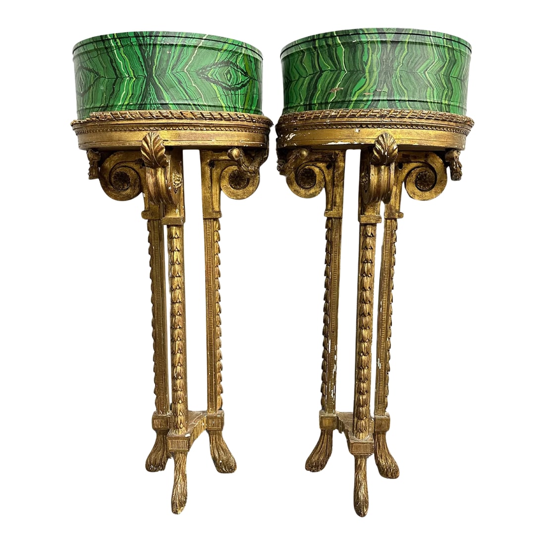 Louis XVI 19th Century Demilune Faux Malachite Tole Planters - a Pair: Late 19th Century/Early 20th Century. Bellflower & rosette decorated stands with hoof feet. Demilune metal forms set with faux malachite painted tole. Demilune planters themselves measure: 14 3/4" W a
