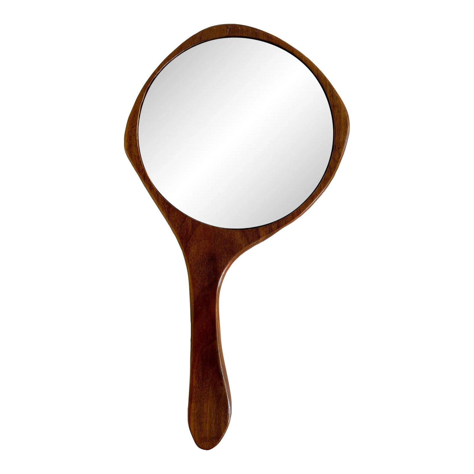 MCM Sculpted Walnut Hand Mirror: Vintage mid-century hand-carved wooden hand mirror. A handsome addition to your dresser or vanity. The round inset mirror measures 6" Condition: Alterations: Original Condition Unaltered