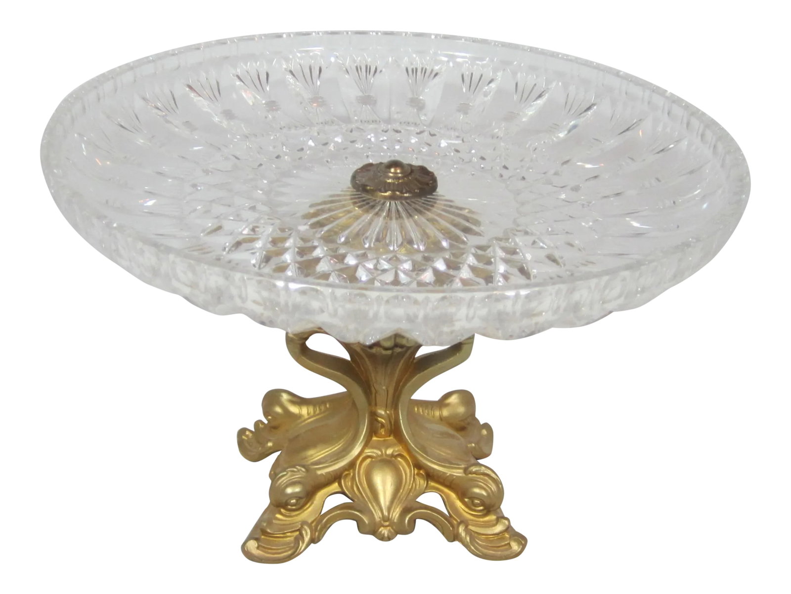 Hollywood Regency Pastry Stand: Hollywood Regency pastry stand. The stand has a elegant crystal plate top supported on a Vintage gold ornate art nouveau base, decorated with four dolphins. Condition: Alterations: Original Condition