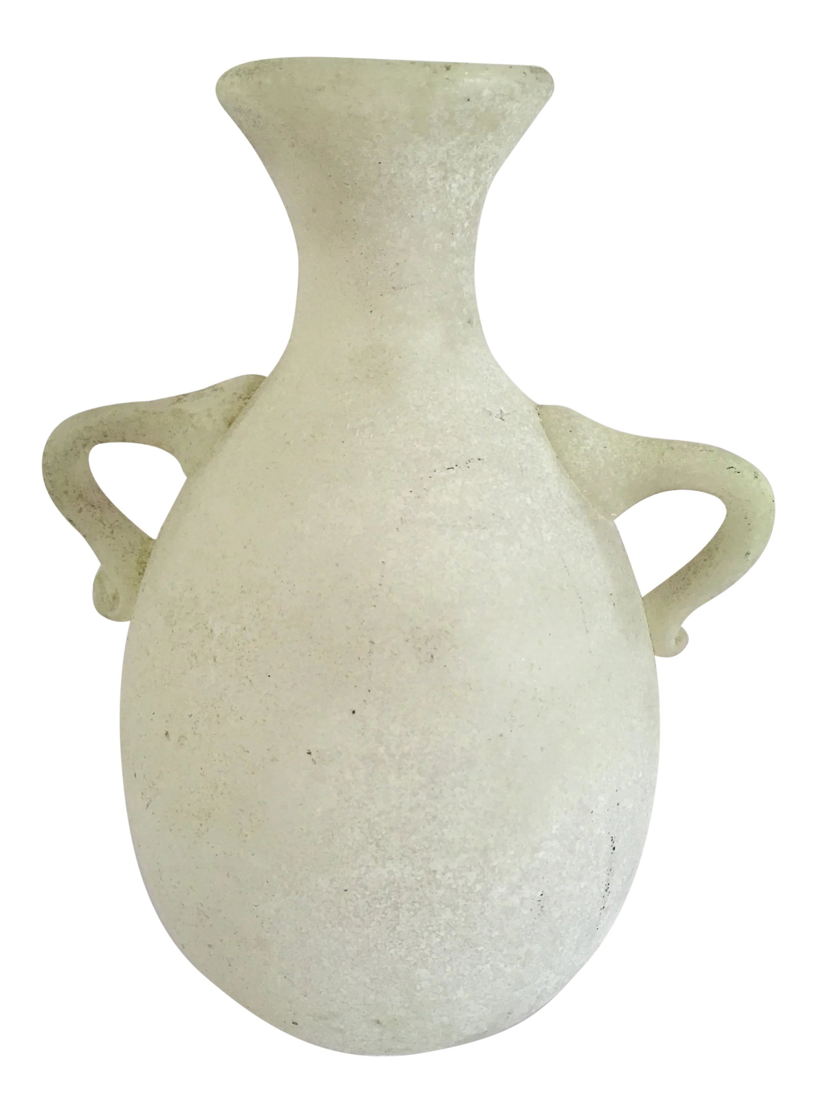 1970s Murano Glass Pale Green Scavo Vase: Petite Murano glass vase in pale green with scavo finish-- produced by Seguso in Venice. It is attributed to Karl Springer as designer since it is of a genre in the Roman style produced by Seguso. It 