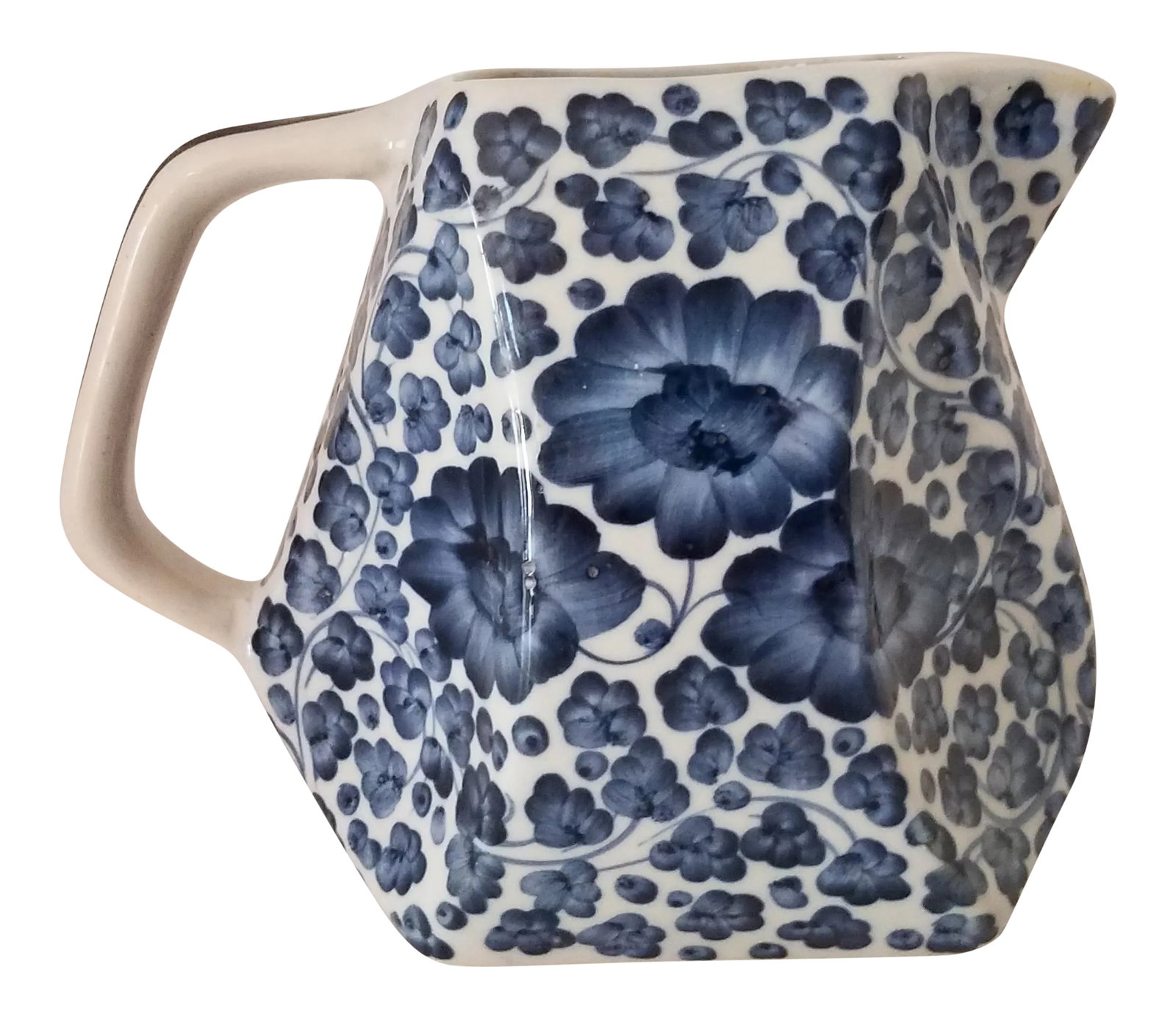 Vintage 1980s Chinoiserie Blue & White Ceramic Beverage Pitcher: Vintage Blue & White Chinoiserie Ceramic beverage Pitcher. This pitcher has a very unique design. It is hand painted with a floral pattern. Condition: Alterations: Original Condition Unaltered Imperfe