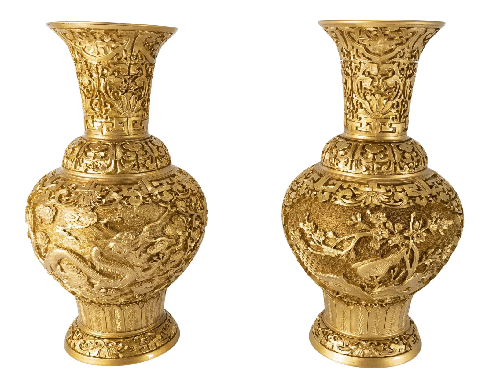 Pair Chinoiserie Hollywood Regency Gold Vases: We are selling this great pair of Chinoiserie Hollywood Regency decorative vases. These vases are imitating cinnabar lacquer but in gold. The two vases have different decorations, one has a dragon