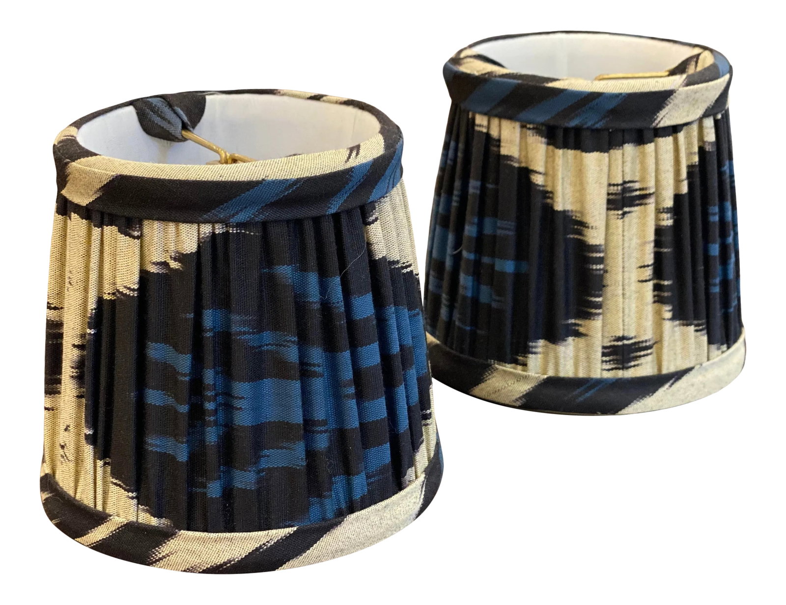 Custom Blue Silk Ikat Abstract Lamp Shades - a Pair: These custom made round Shades feature a fascinating blue silk Ikatand navy abstract pattern. They are perfect for adding some color to Sconces. With a bulb clip, they are easily fitted to your