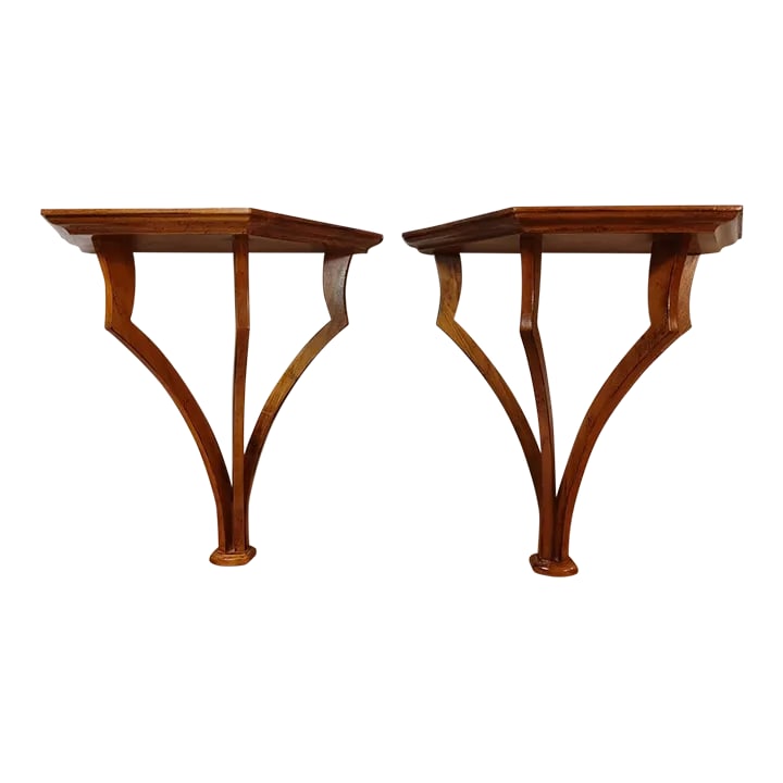 Pair 1990s Wood Wall Shelves: Interesting pair of solid wood wall brackets with an open design. Can be used next to each other to support a piece of glass or used under artwork as an accent. So many unique ways to incorporate