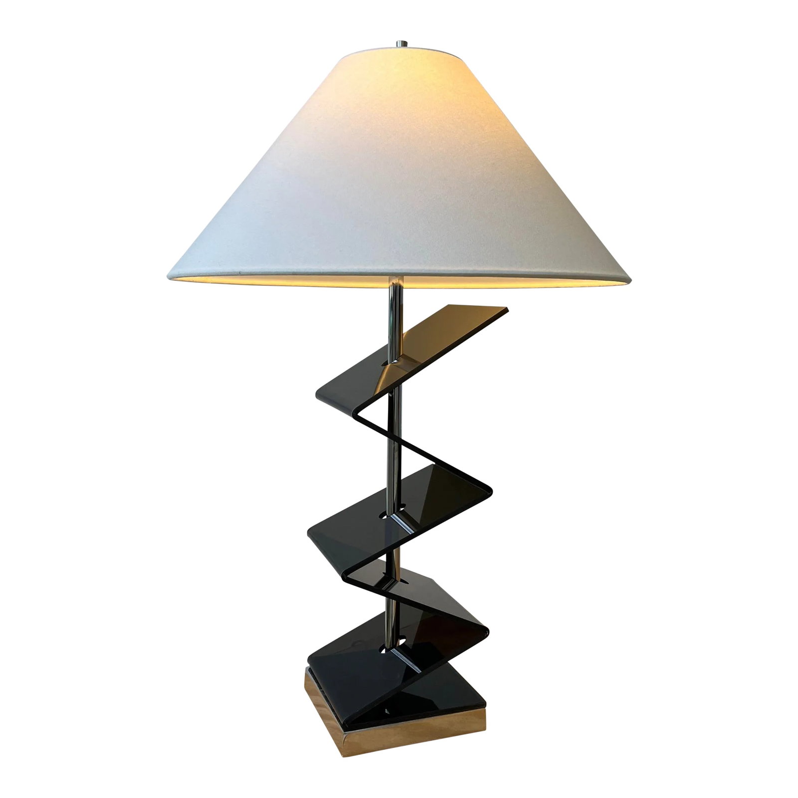 Vintage Smoke Gray Zig-Zag Plexi / Acrylic Table Lamp, Circa 1970s: Vintage Smoke Gray Zig-Zag Plexi / Acrylic Table Lamp, Circa 1970s. Bent smoke acrylic form pierced with a chrome shaft mounted on a square chrome base. Shown paired with a conical shade, Sold