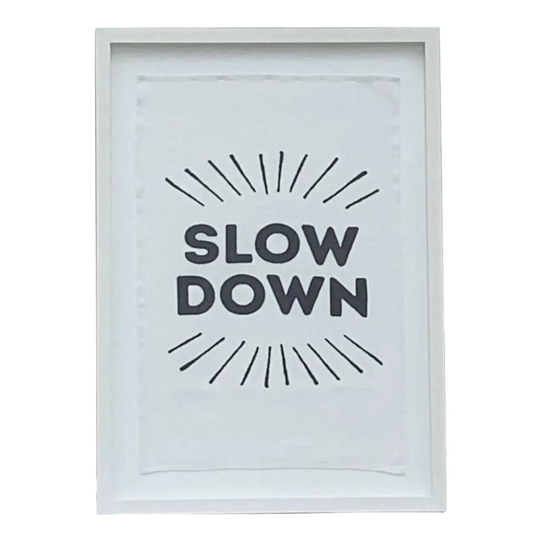 "Slow Down" Framed Tea Towel: This Framed "Slow Down" Towel is the perfect reminder to take it easy. Would look great in a number of spaces. The towel is framed in a custom frame with white wood trim. This clean look will