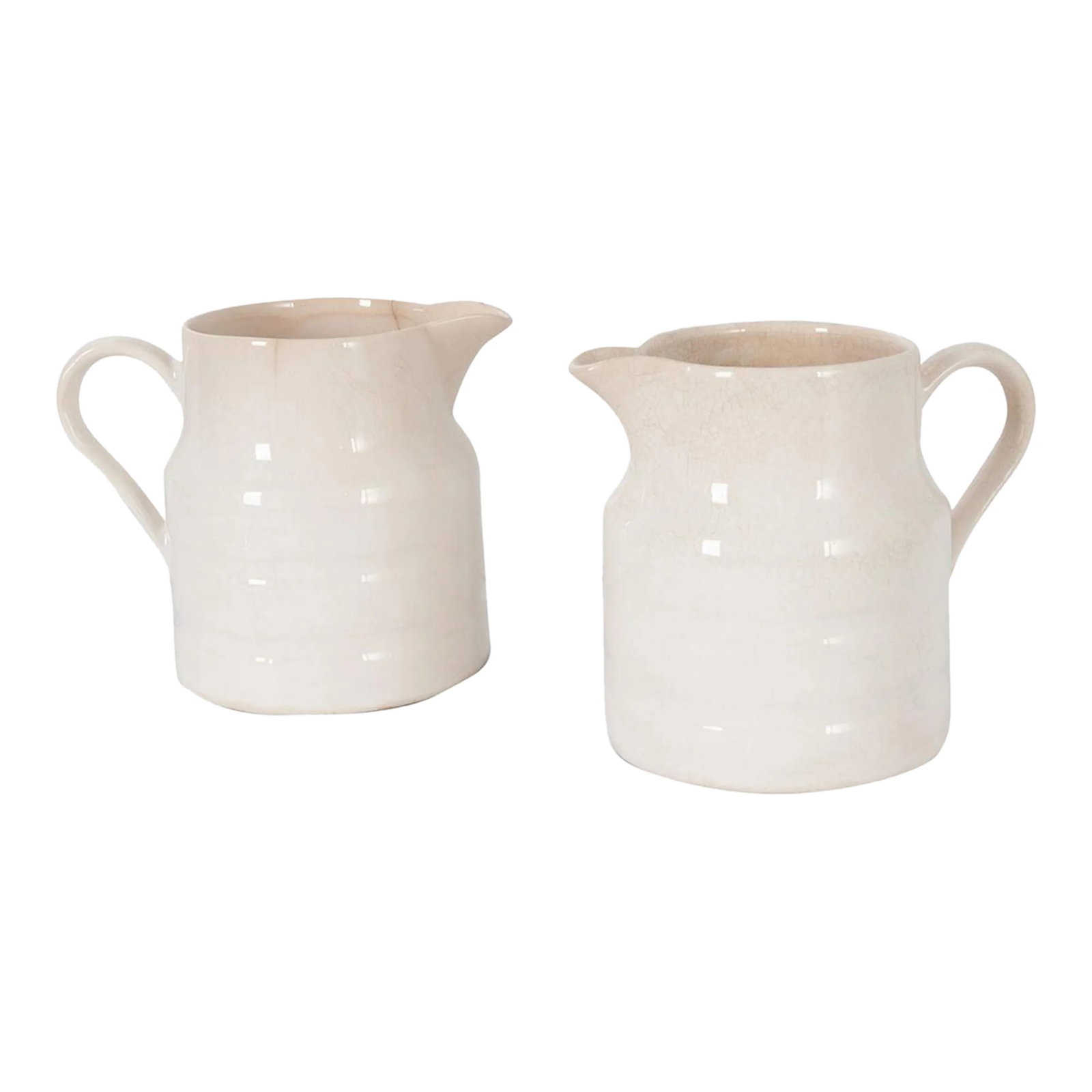 English Early 20th Century Ironstone Dairy Pitchers - A Pair: A darling pair of ironstone dairy pitchers, made in Staffordshire, England circa 1920. The pitchers have a wonderful banded design that provides an elevated sophistication without a hint of