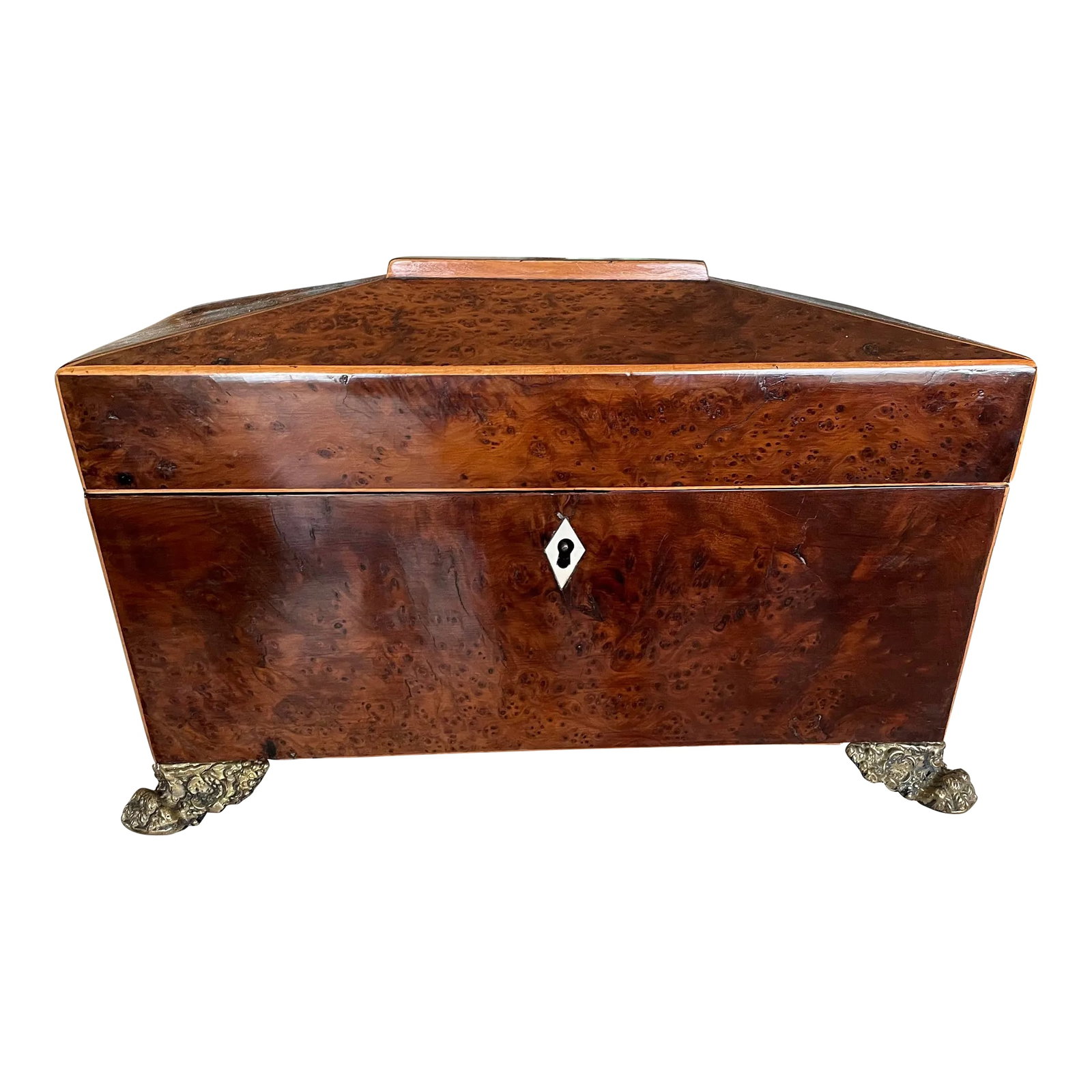 Antique Regency Yew Burled Footed Tea Caddy: Large and gorgeous sarcophagus shaped yew Regency tea caddy with ring handles and ornate grape motif brass feet. Caddy has two compartments and a mixing bowl in the center This is a sizable piece for