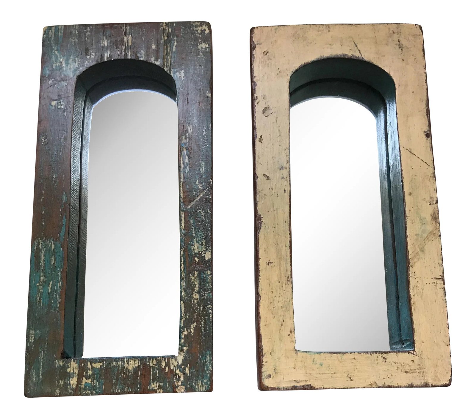 Vintage Indian Archway Painted Teak Mirrors - A Pair: A pair of vintage Indian archway mirrors with distressed painted teak frames. Purchased in India. Each mirror measures , 8"H x 4"W x 1"D. No maker's mark. Some wear and chips. Condition: Condition