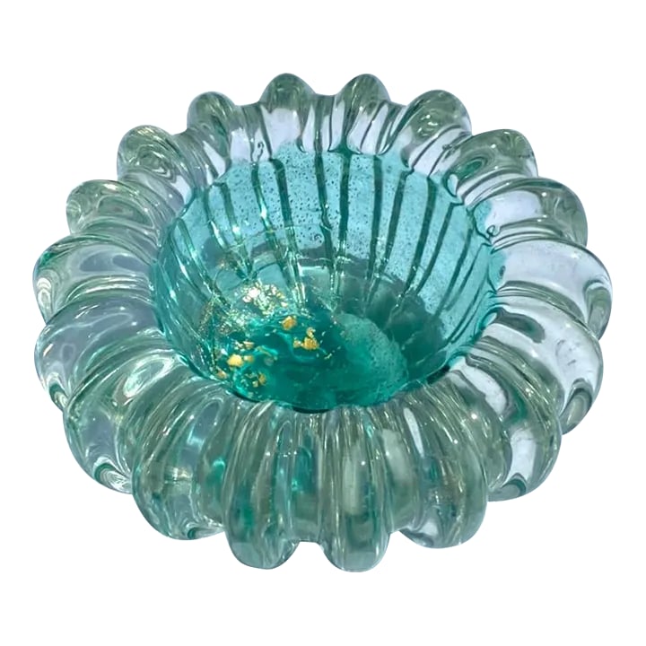 Vintage Murano Art Glass Bowl: This is a vintage murano art glass bowl. The entire of the bowl is done in a beautiful thick clear glass. The interior of the bowl is finished with a pale aqua color and gold leaf inclusions. The