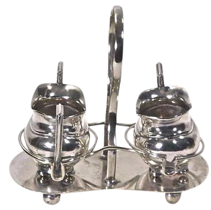 Antique English Creamer and Sugar Dish with Tray: Looking for a unique, decorative piece for your home? Check out this English, silver-plated, cream and sugar antique and silver caddy! Made in the early 1900s, the pieces are marked by "EPNS, Made In 