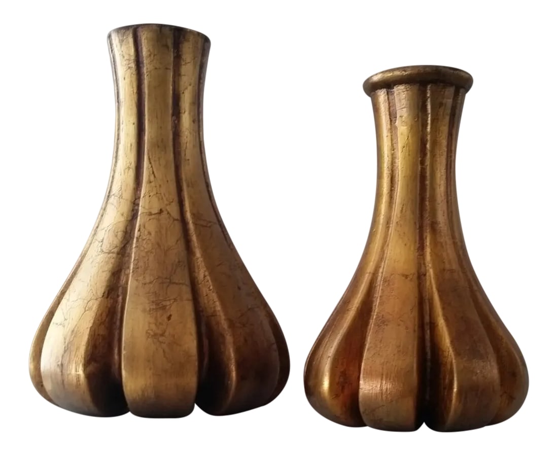 Mid-Century Modern Gold Decorative Vases - a Pair: Set of 2 unique mid-century decorate objects/vases made of plaster and painted a rich, gesso gold. Fluted exterior with a wide base, these objects feel fresh and timeless displayed on a bookshelf or m