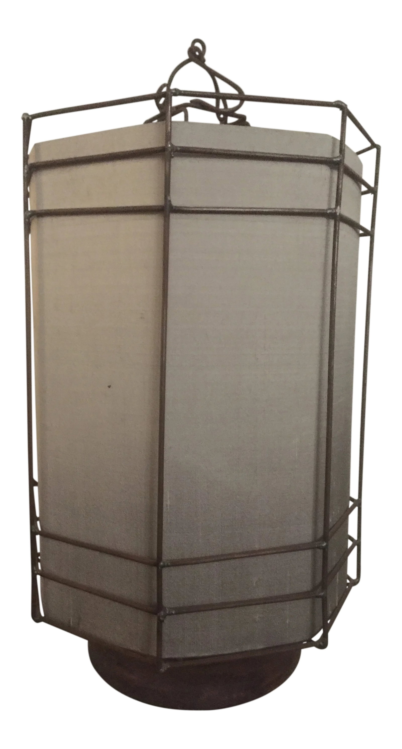 Modern Zen Lantern: This modern octagonal shaped lantern has a Zen-chic look. The handmade antiqued metal frame stands straight up from top to bottom and holds the shantung silk shade. A round wood base holds the metal