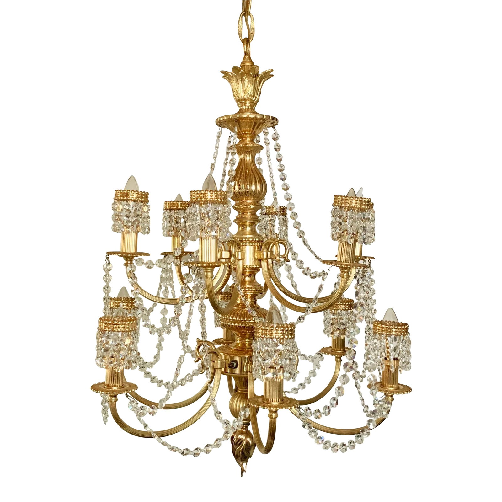 1970s 12 Light Hollywood Regency Crystal Waterfall Chandelier: Stunning grand-scale circa 1970s Hollywood Regency chandelier with crystal waterfall bulb covers. Features 12 lights and a 3-way switch on the chandelier body. Made of a gleaming golden metal. Very