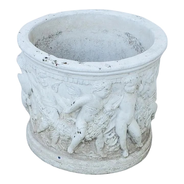 Antique Round White Cement Relief Cherub Planter: This antique Italian style planter features a beautiful relief design of a wreath of cherubs, perfect for any room or occasion. The round white cement pot is 16 inches in diameter and 12 1/4 inches in