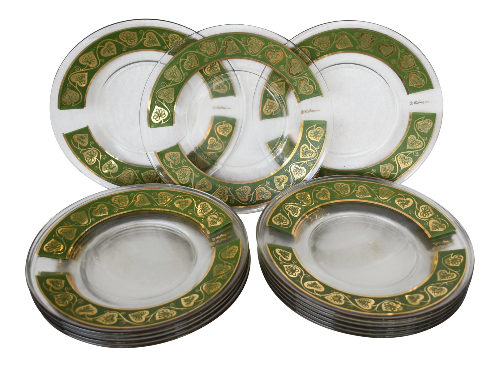 Vintage Culver Ltd. Plates - Set of 12: A fabulous set of 12 Culver Ltd. salad/dessert plates with a green trailing hearts design in 22 karat gold on green background. These are pre-owned items so please see all pictures and ask any