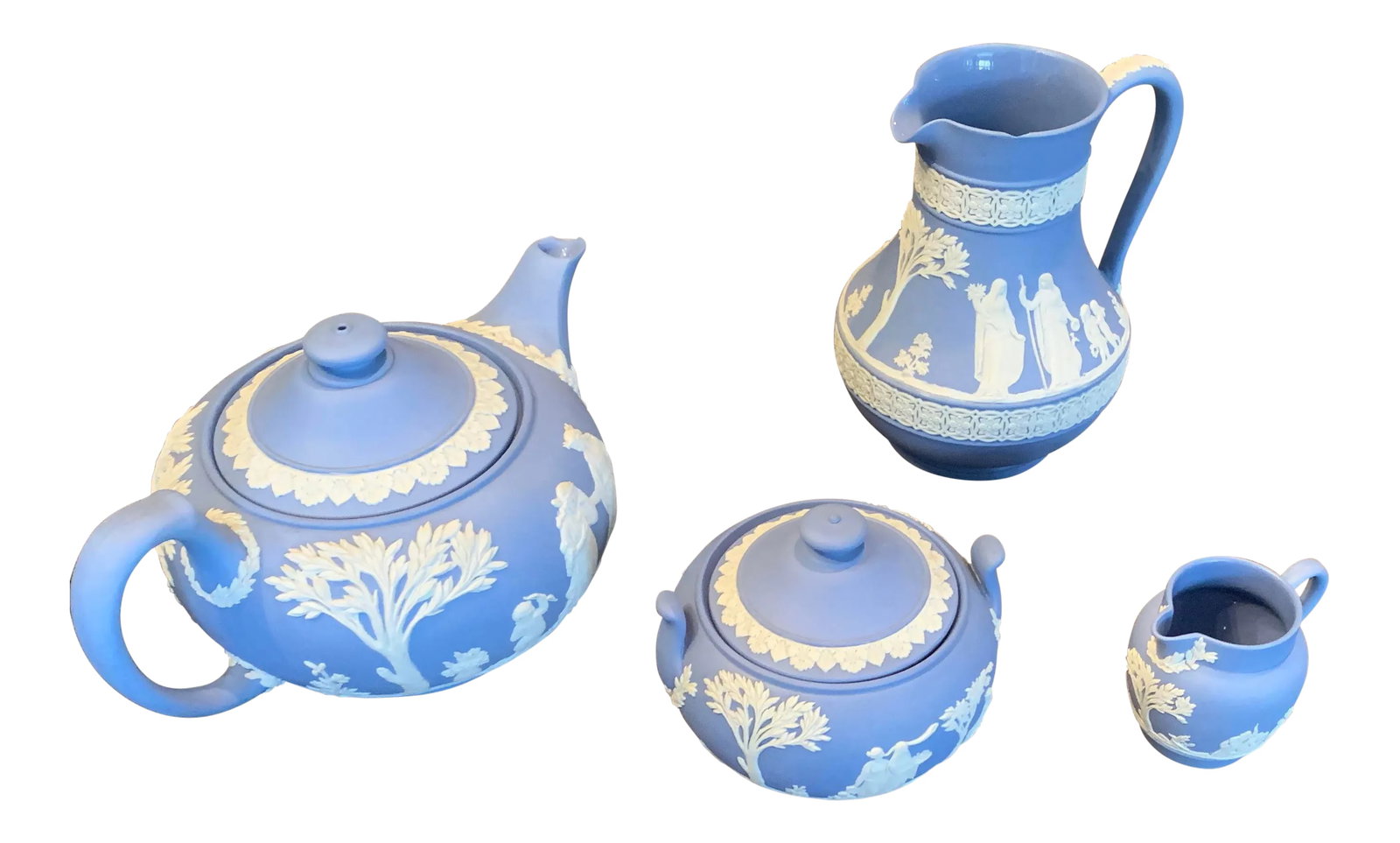 1960s Wedgwood Tea Service - Set of 6: Vintage Wedgwood Tea Service inherited from my Mother in law. The set includes pitcher, teapot, sugar bowl, and creamer. The creamer's handle has been fixed. there are two tiny chips on the side of