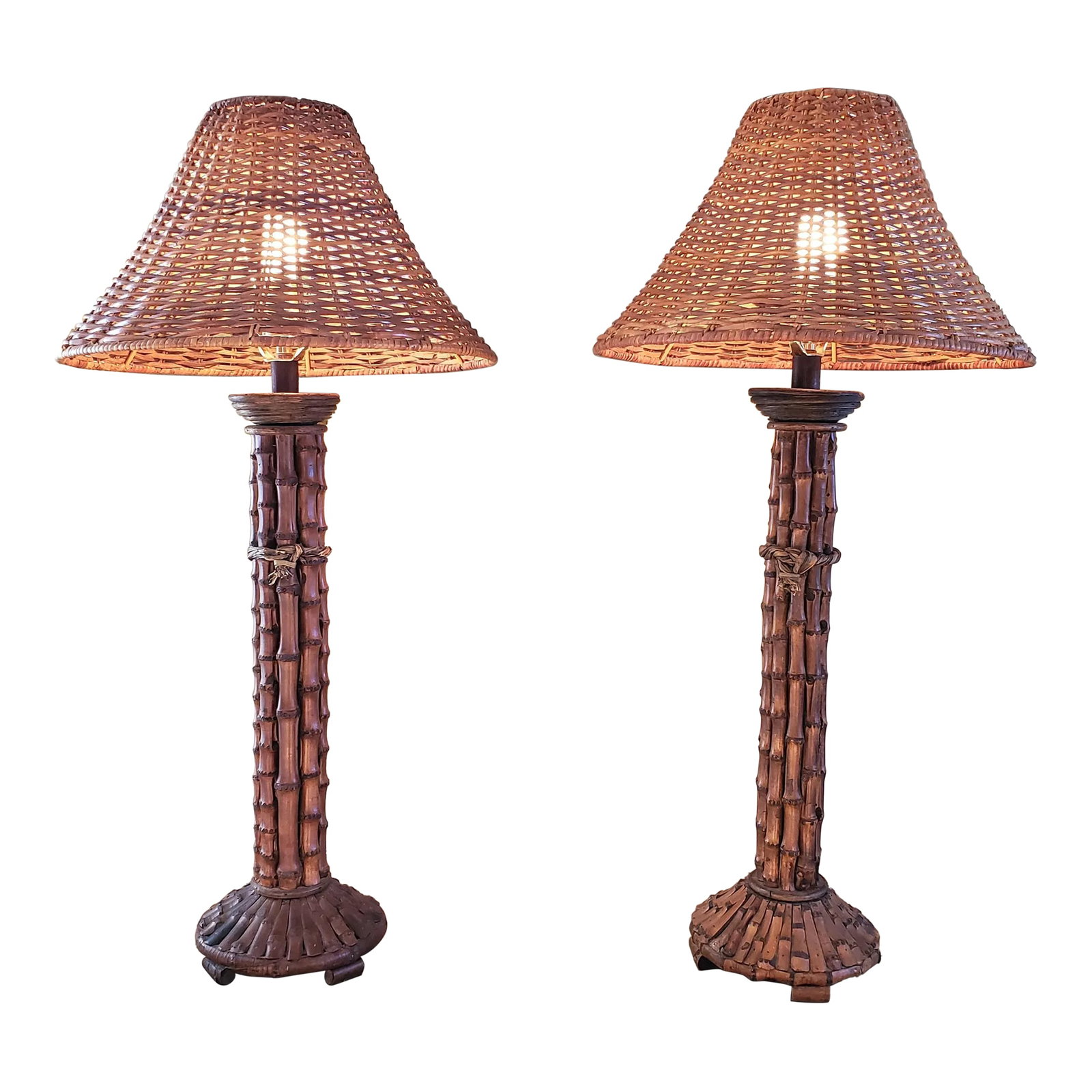 Vintage Pair Mid 20th Century Rattan Bamboo Table Lamps With Woven Rattan/Wicker Lamp Shades: Beautiful Vintage Pair (2) Rattan Bamboo Table Lamps 32" tall with matching Woven Rattan/Wicker Lamp Shades and finials. Rustic tall round rattan table lamps feature a grass -wrapped tie around the
