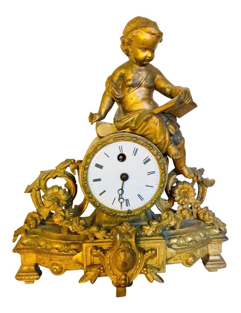 Victorian Ormolu Mantel Clock: Gilt French Rococo Revival mantel clock crested with cherub writing in book. The mark is inscribed: PH Mourey 66 Movement by: Japy Freres, France Dimensions: 10.5" x 4.5" x 13" 19th Century