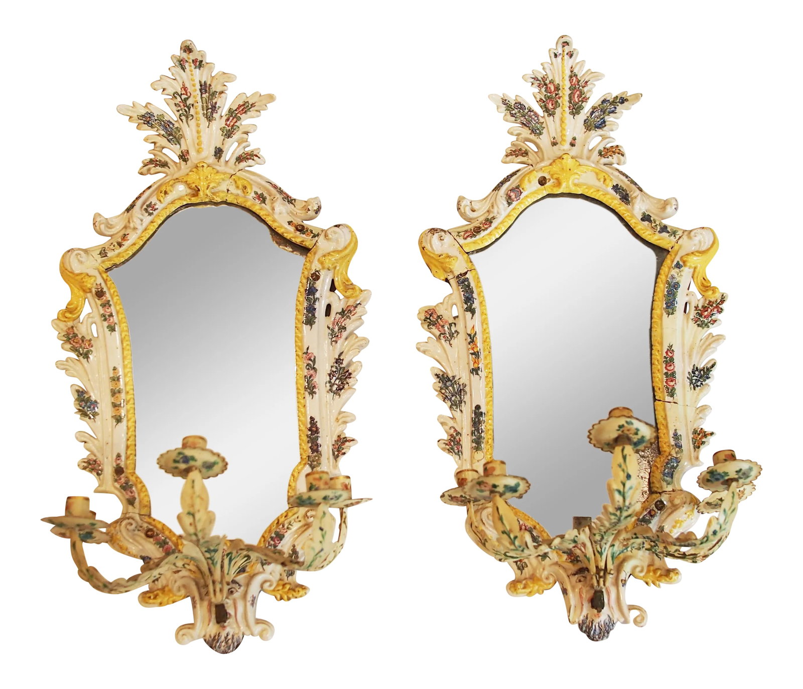Large Pair of Italian Ceramic and Tole Sconces: Elegant and charming pair of rococo style wall lights, the ceramic back plates surrounding mirror and having arched tops crowned with palmettes. The ceramic frame is constructed in pieces supported by