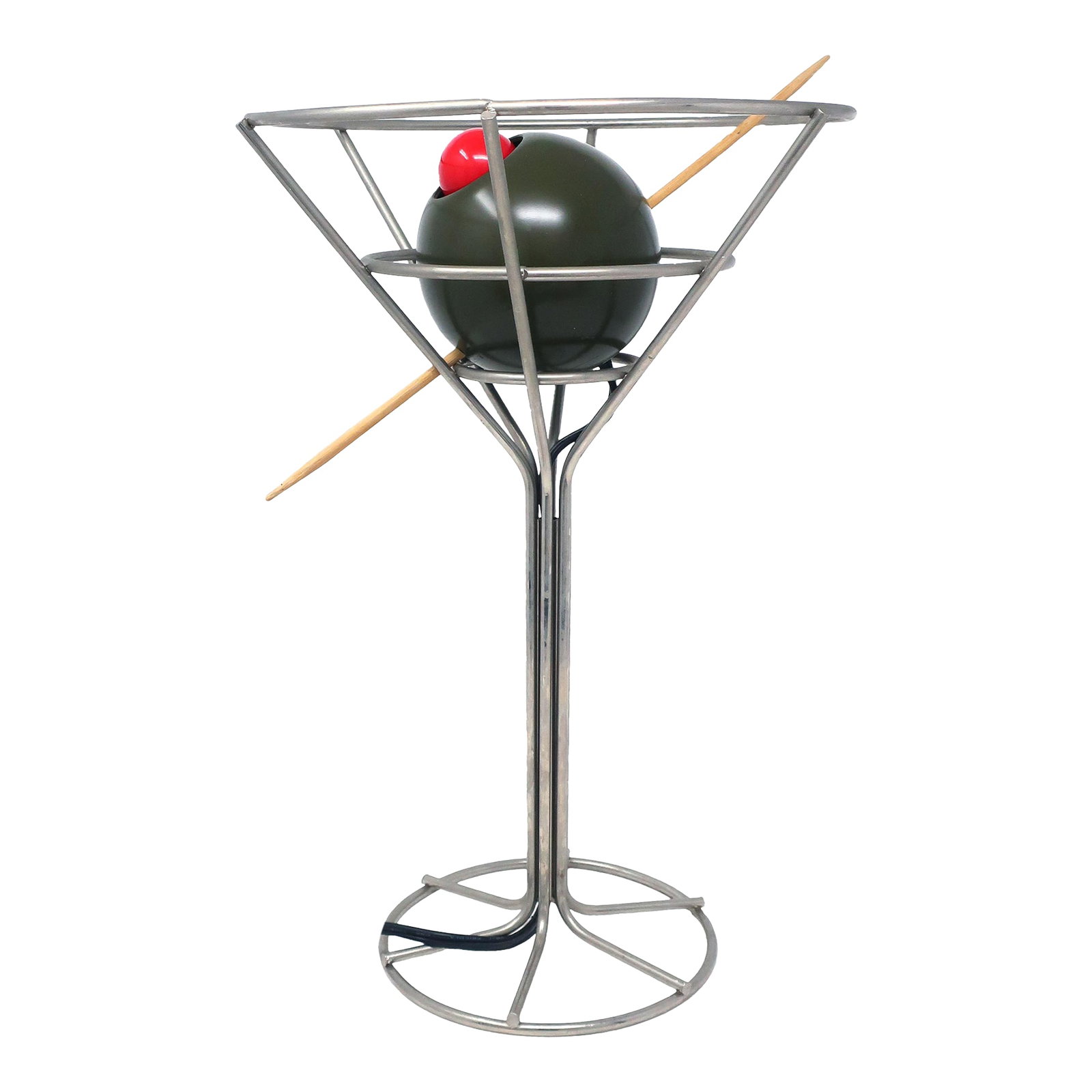 Postmodern Martini Lamp by David Krys: A rare 1993 postmodern martini lamp designed by David Krys. Metal wire forms the glass' shape with a skewered green olive stuffed with a red light bulb disguised as a pimento. Great for lovers of pop 