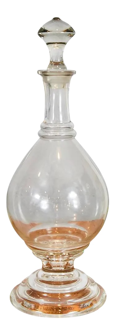 Glass Apothecary Bottle: This exquisite glass apothecary bottle has a separate base and bottle that fit snugly together. The beautifully stopper measures 4.5". United States, 19th Century Condition: Alterations: Original