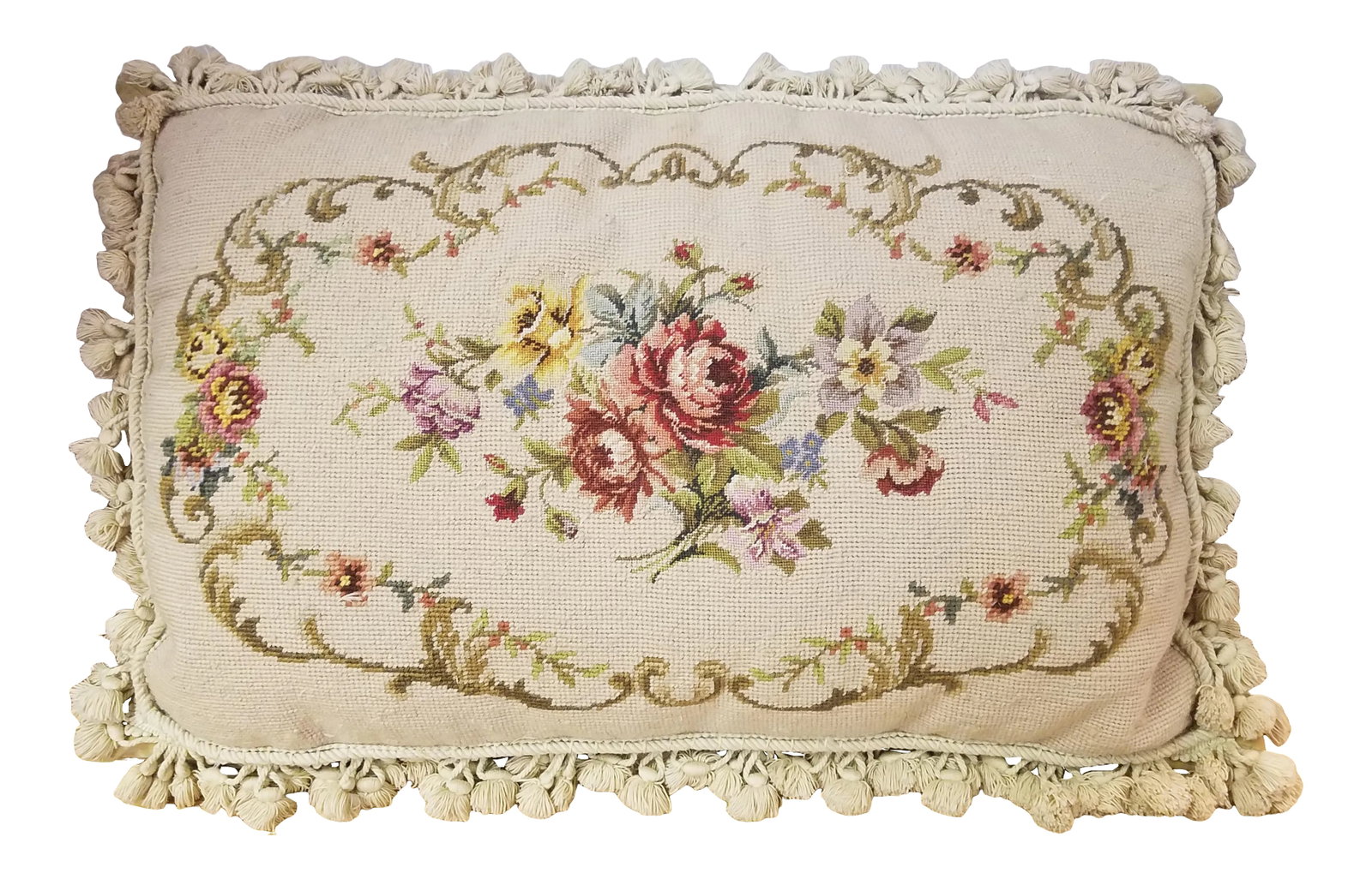 Vintage Early 20th Century Needlepoint Pillow: Vintage needlepoint and pettipoint pillow. Top is wool and the back is velvet in a soft gold color. The tassel trim is beige. There is a zipper closer and a down filled insert. Please see photos for