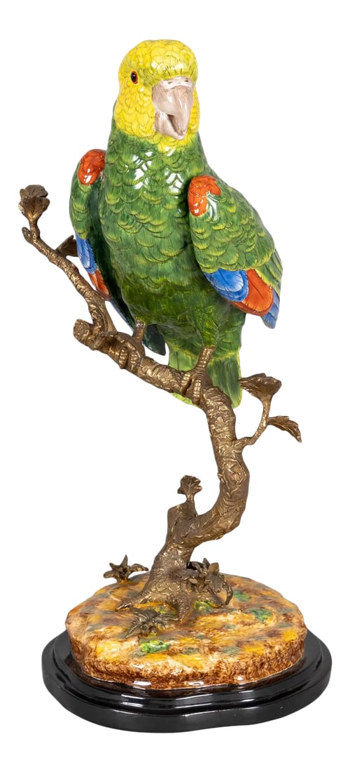 Chinese Porcelain Parrot: Chinese porcelain colorful green, yellow, orange and blue parrot perched on a gilded bronze tree trunk mounted on ochre and green colored earth with gilded leaves and black stepped base. Condition: