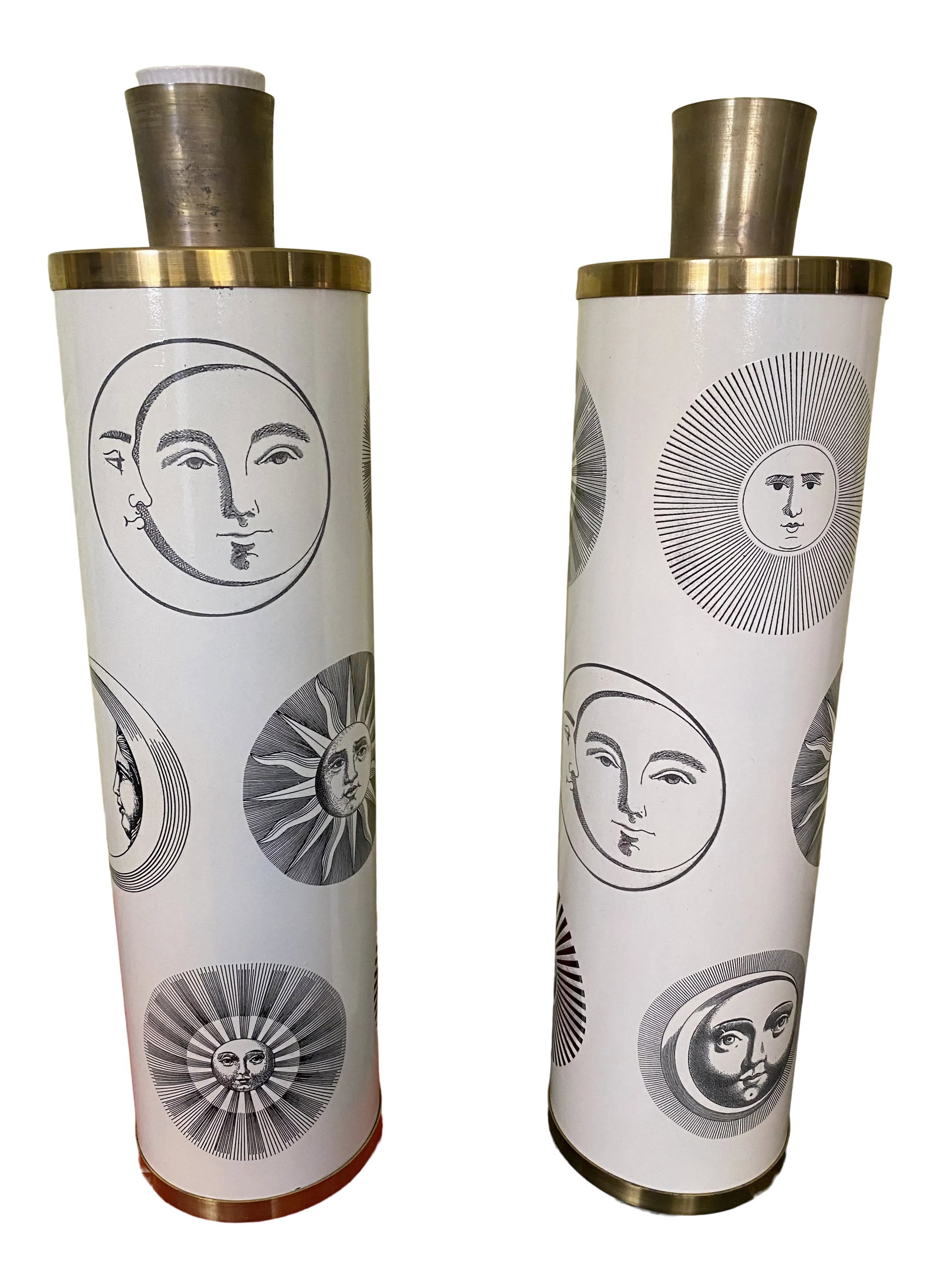 Piero Fornasetti Sun and Moon Phase Table Lamps - Set of 2: This is a fantastic and graphic pair of Fornasetti Italian table lamps. They are white with black images of different Suns and moons. They are very striking in person. One lamp is missing small