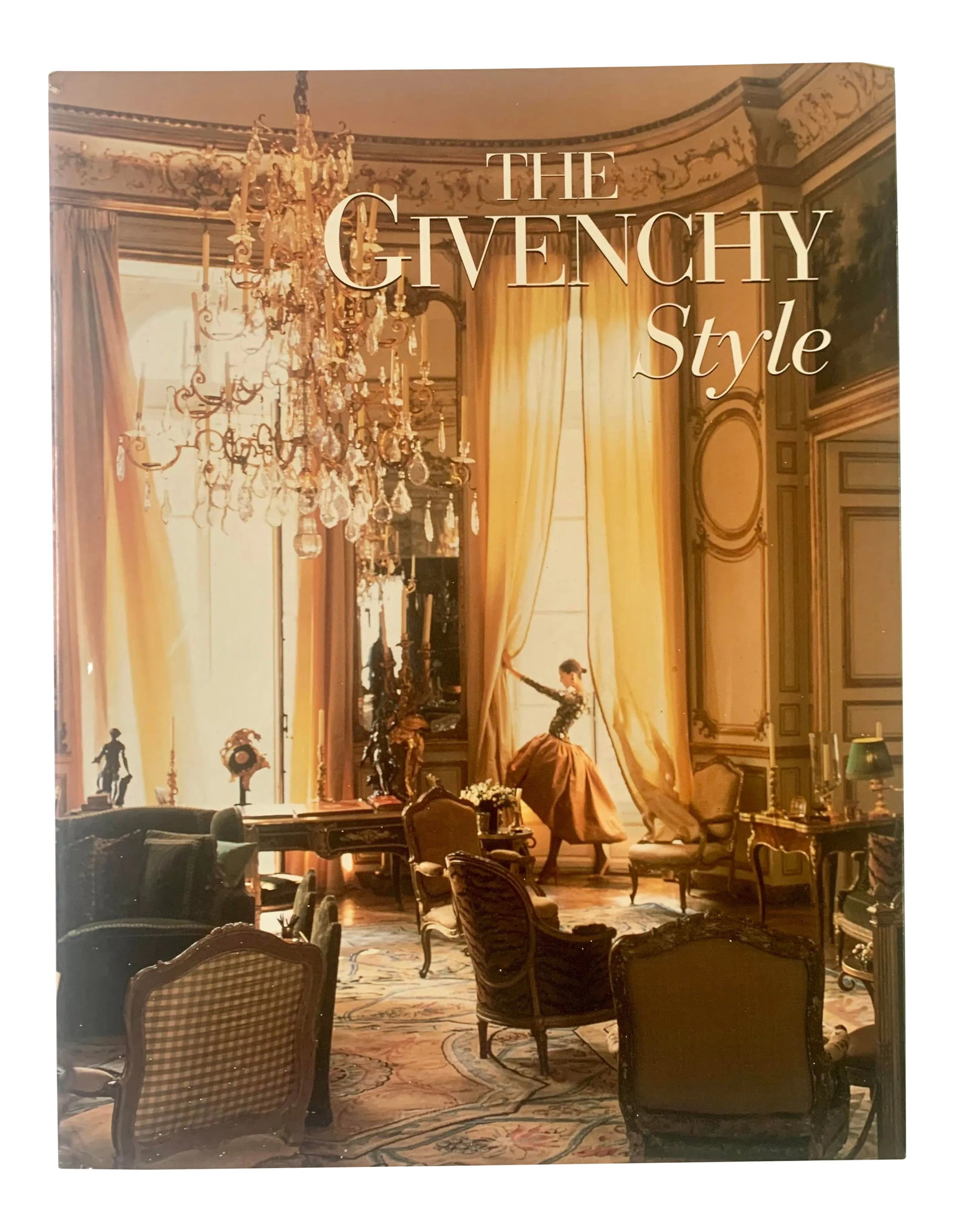 1998 Givenchy Style, Francois Morht, Vendome Press: Hardback with cloth covers in protected dust jacket, in very good condition. This book follows its distinguished subject through his own couture salons, offices and workshops, his different homes in P