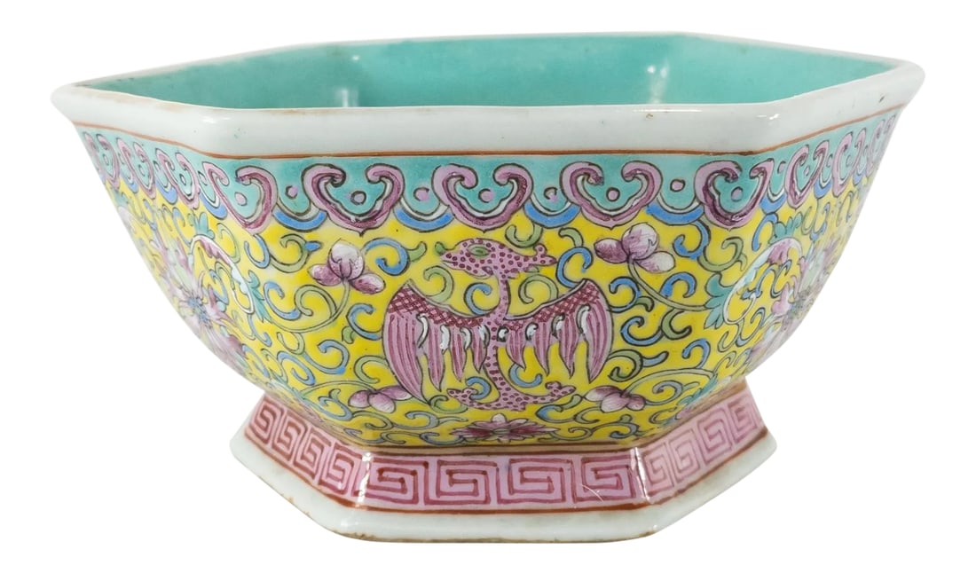 Early 20th Century Chinese Pink and Yellow Straits Porcelain Bowl: We are selling this brightly enameled Chinese porcelain bowl. The bowl is painted in Straits Famille Jaune style enamels with bright pink lotus flowers and dragons. There is heavy wear to the green