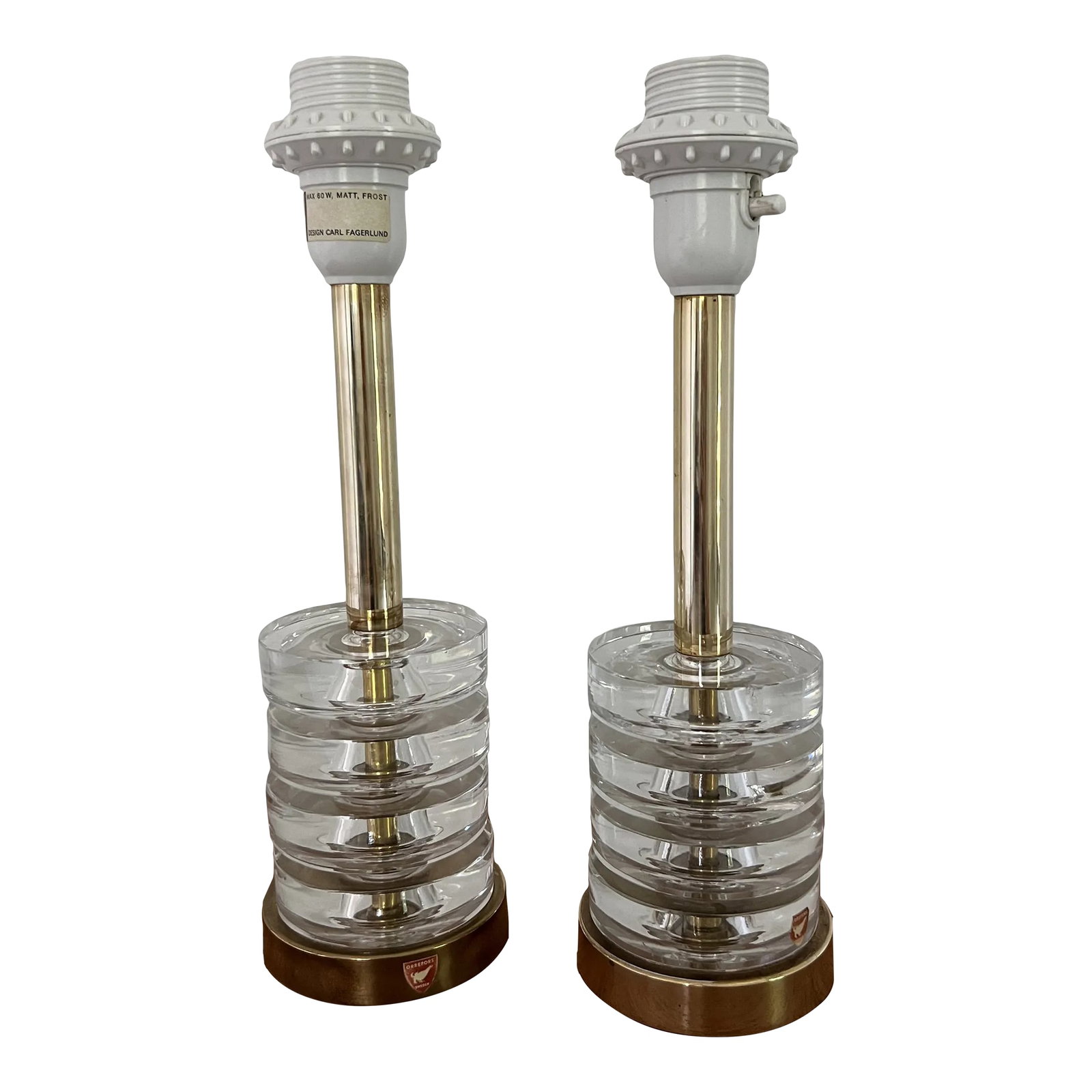 Carl Fagerlund Table Lamps for Orrefors Model Rd1981 - a Pair: Beautiful lamps model RD1981 designed by Carl Fagerlund for Orrefors in Sweden. Wiring is original with European plug sold with adaptor plugs. Original condition minor chip in the crystal and brass ha