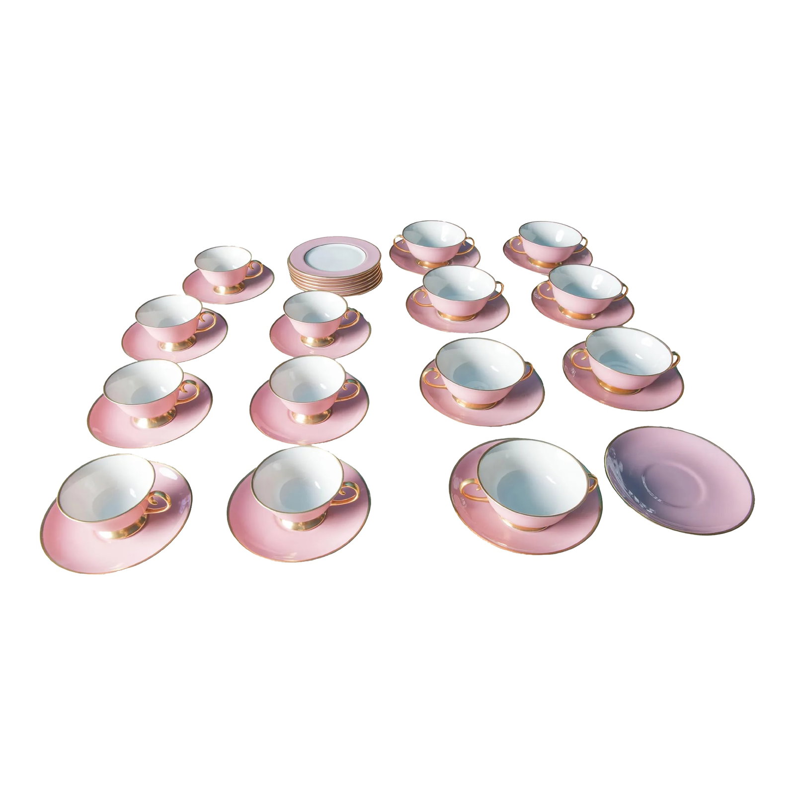 Carole Stupell Pink & Gold Tea Set & Cream Soup Bowls - 21 Pieces: Carole Stupell, Ltd. china made by Flintridge China in California. The Flintridge China Company began in Pasadena, CA in 1946. It was acquired by Gorham in 1970. This set includes 7 cups and saucers, 