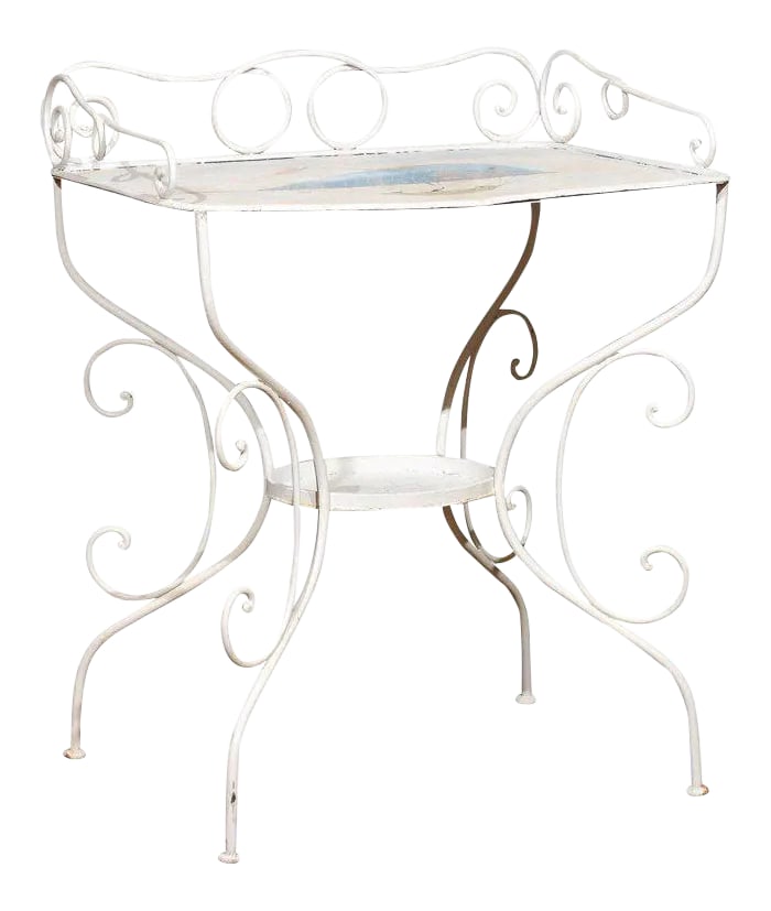 French Wrought Iron Garden Table With Steampunk Painting: Charming late 19th Century French wrought iron garden table painted in white with a charming Victorian era steampunk illustration of a whale shaped hot air balloon carrying three sailors in a