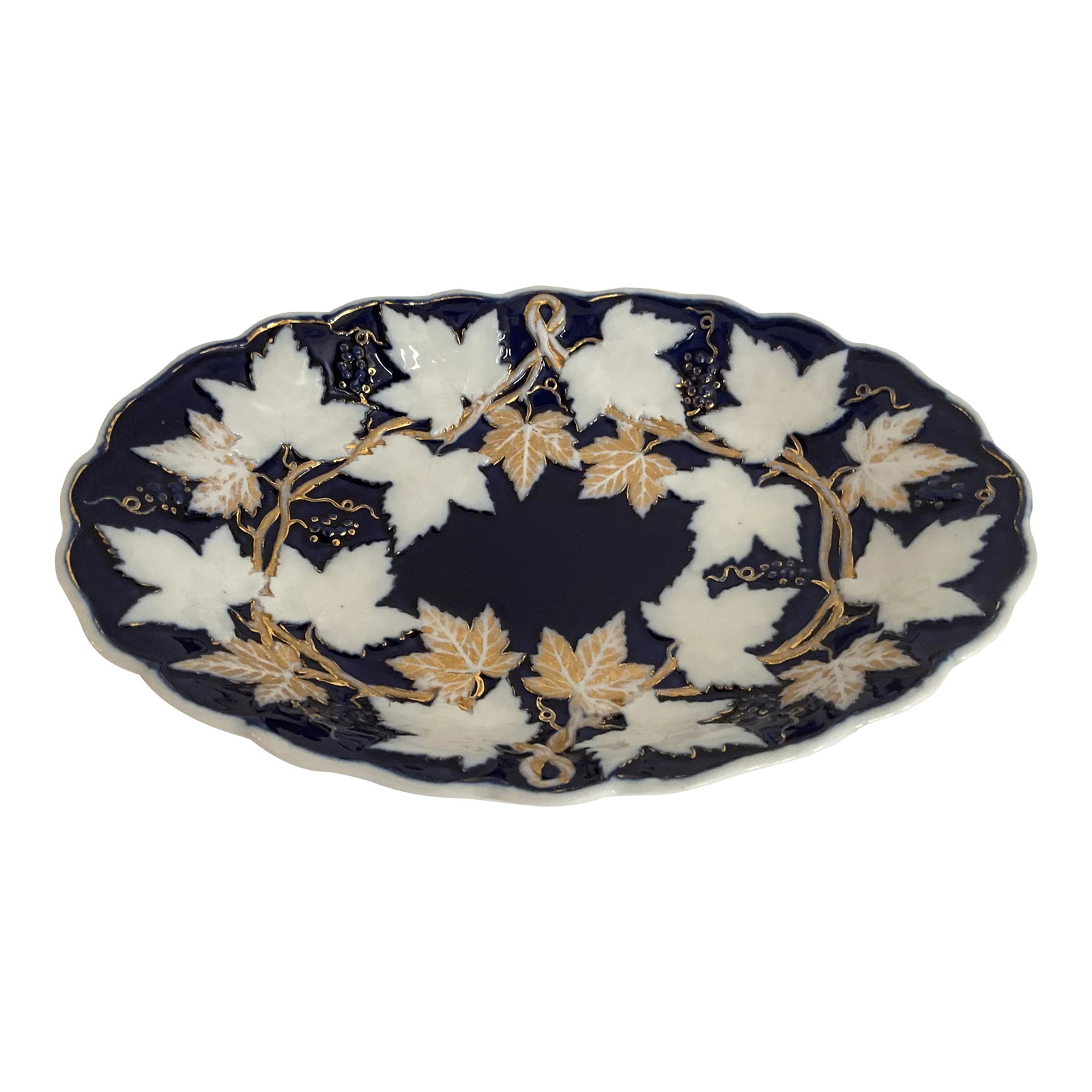 Late 19th Century Meissen Maple Leaf Serving Platter: This Meissen Serving Platter is both stunning and rare. Meissen is known as the oldest and most luxurious porcelain in Europe and was first produced in 1710. Condition: Alterations: Original