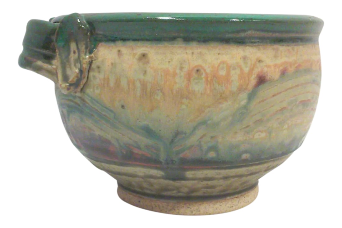 Hand Thrown Ceramic Decorative Bowl: A wonderful hand thrown studio pottery ceramic decorative bowl with a muted matte drip style glaze in a matte finish and a hand formed and applied handle. This vintage bowl could be used as a planter