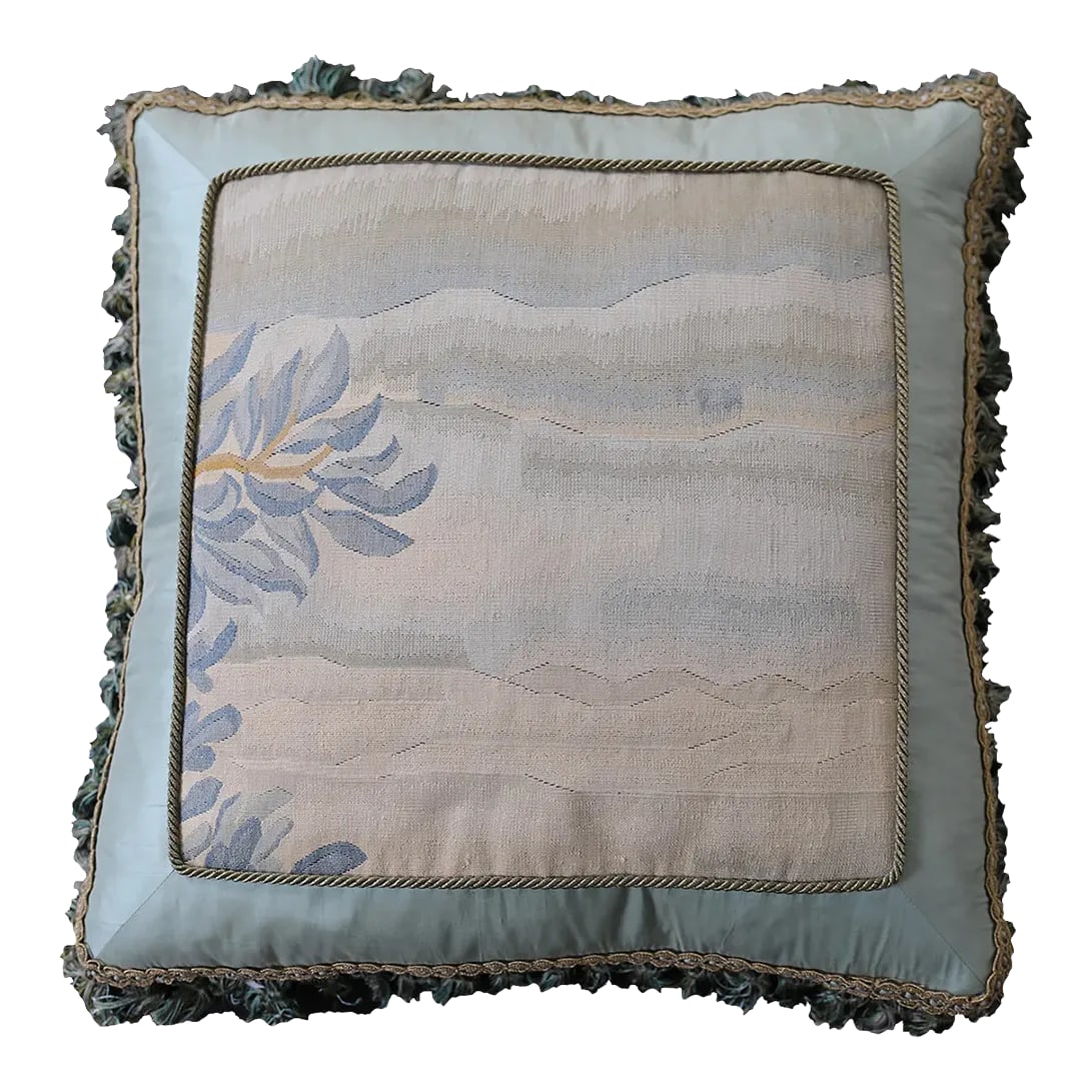 Light Blue Aubusson Silk Decor Pillow: Introducing our exquisite Aubusson-style pillow, meticulously crafted from a blend of silk and wool. Adorned in soothing light blue hues, this pillow features a breathtaking woven landscape at its