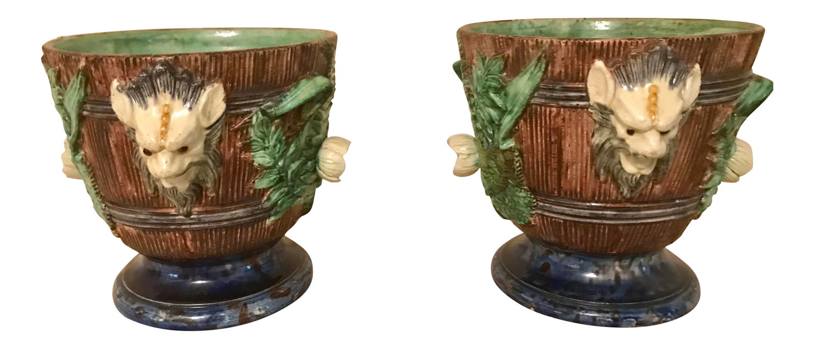 19th Century French Majolica Jardinieres - a Pair: A Pair of 19th Century French Majolica Jardiners with flowers and foliage and mythical creature handles. Circa 1875. Excellent condition. Condition: Alterations: Original Condition Unaltered Imperfect