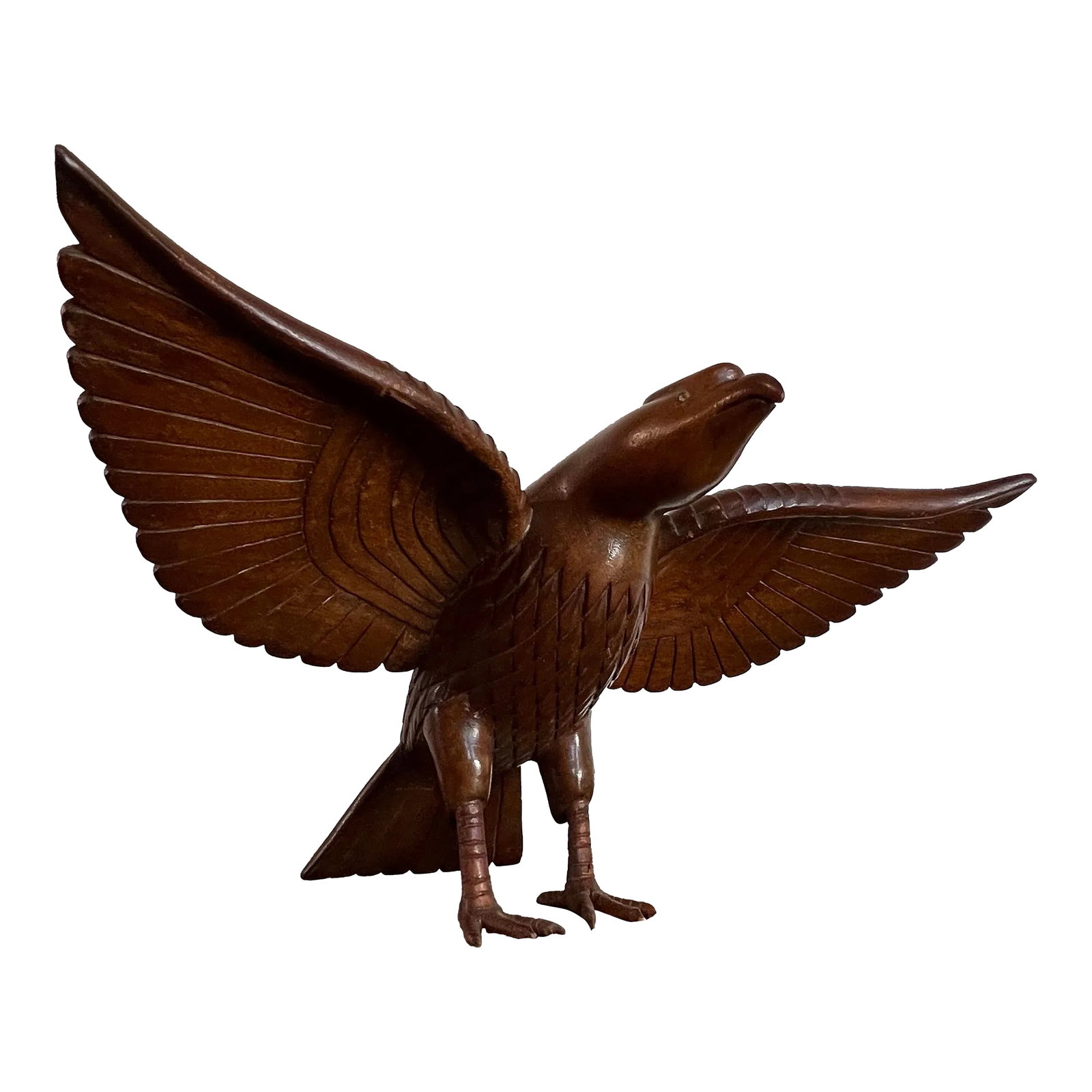 Vintage Falcon Wood Carving: Beautiful hand carved wooden falcon bird in great condition. Ornate detail in the body standing upon 2 carved feet with two faux gemstones in place of each eye. Stands approximately 13.5 inches wide a