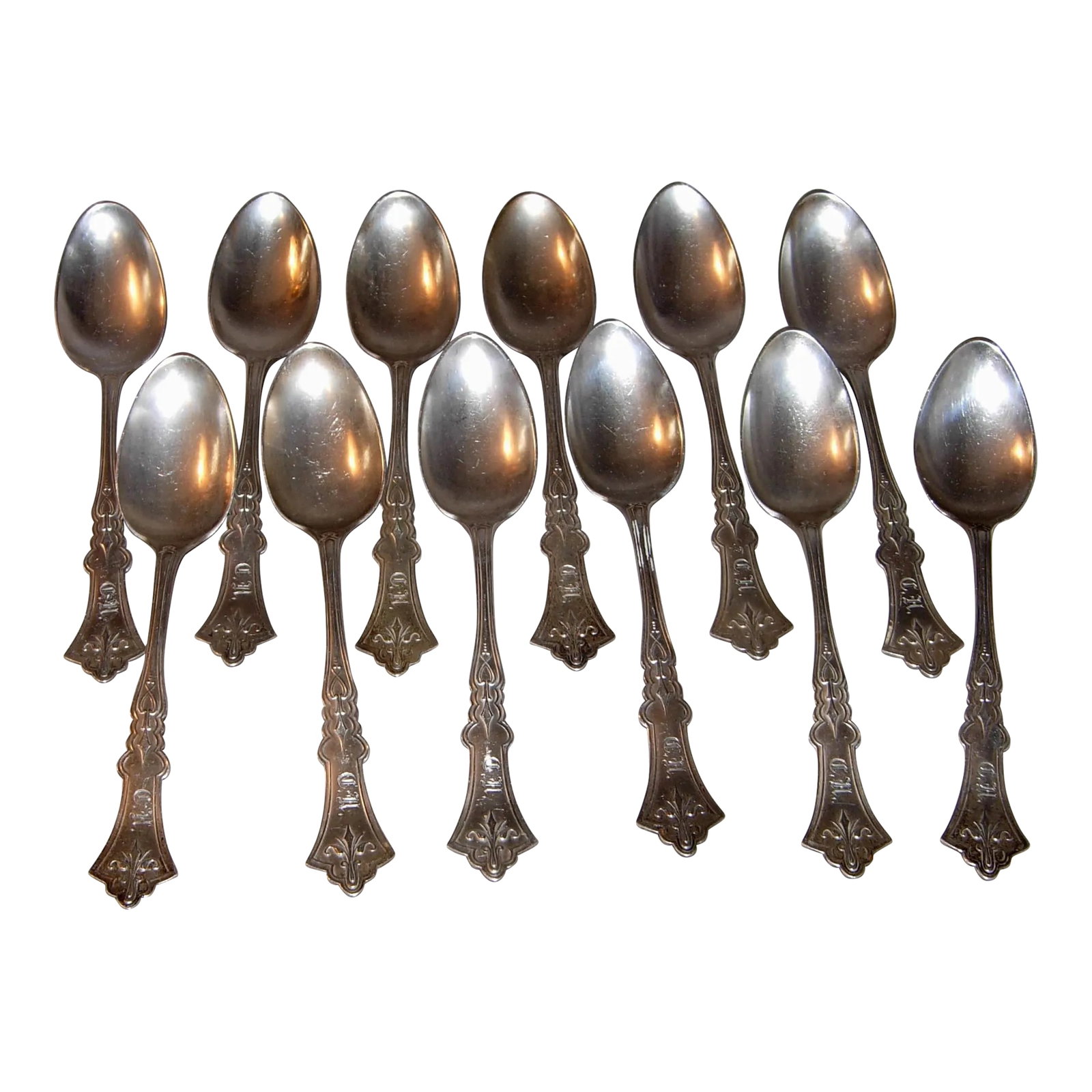 Mid 19th Century A. C. Benedict Coin Silver Teaspoons- Set of 12: Offered are 12 A.C. Benedict Coin Silver Teaspoons in the Clemantis pattern. Andrew C. Benedict was a silversmith & watchmaker in New York City 1827-1846. Each teaspoon is 6" long with a monogram of