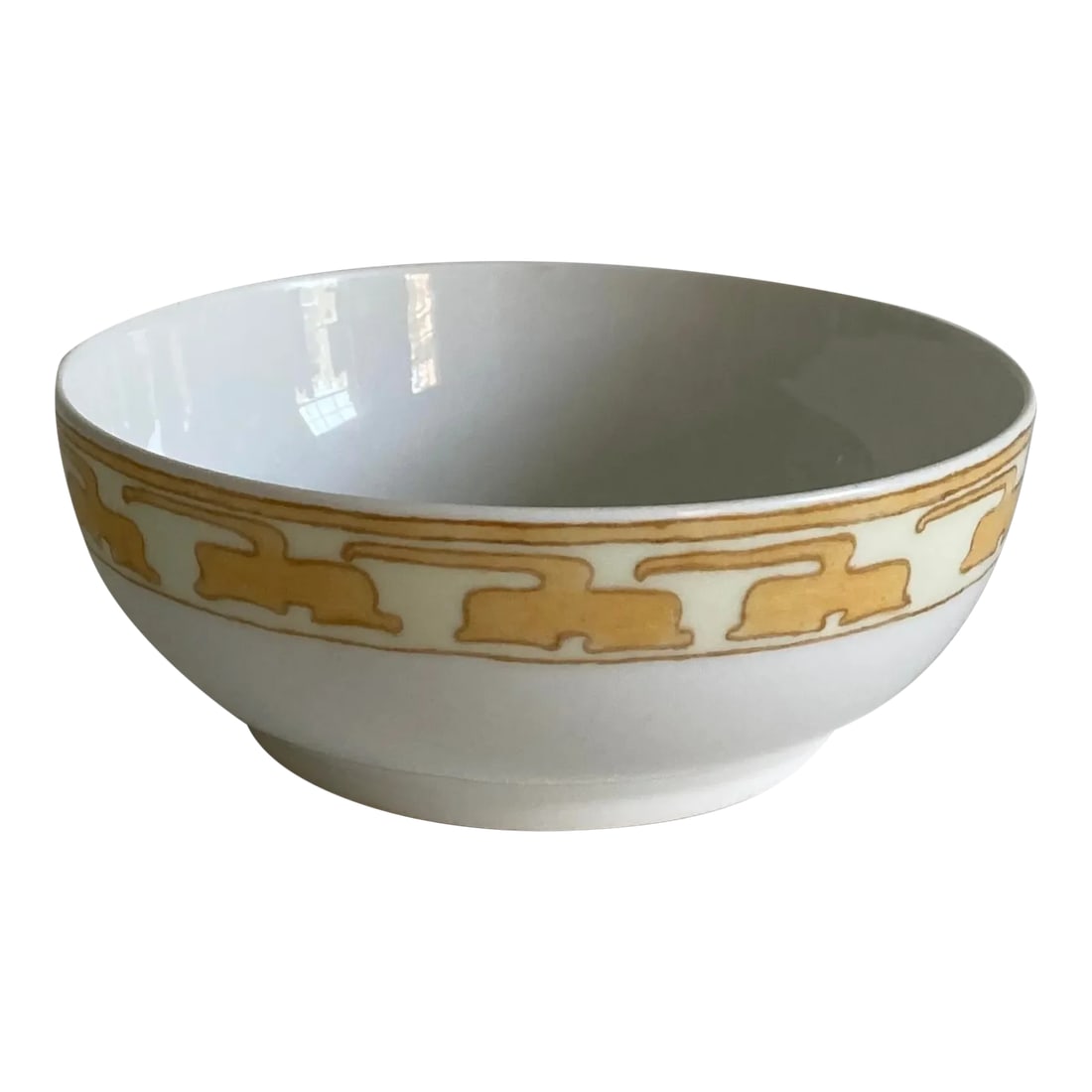 Circa 1905 Tressemanes & Vogt Art Nouveau French Limoges Hand Painted Porcelain Decorative Bowl: An early 20th century, French Limoges porcelain bowl with a hand painted exterior design in an art nouveau floral pattern in a muted mustard yellow, gold, and ivory colors on a white, porcelain