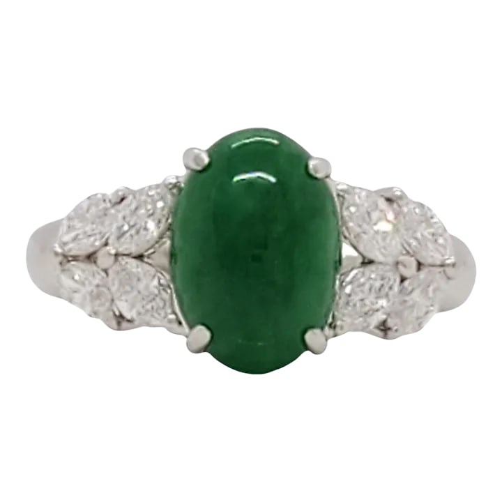 Green Jade Cabochon and Diamond Cocktail Ring in Platinum, size 4.25: Beautiful deep green jade weighing 2.29 ct. with 0.49 ct. good quality white diamond marquise cuts. Handmade in platinum. Ring size 4.25. Metal: Platinum Stone: Diamond,Jade Stone Cut: Oval Cut