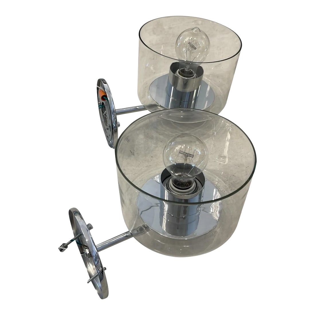 Pair of Glass & Chrome Wall Sconces: Add a touch of modern elegance to your space with this pair of glass wall sconces featuring sleek chrome hardware. The translucent glass shades provide a sophisticated and airy feel, while the chrome