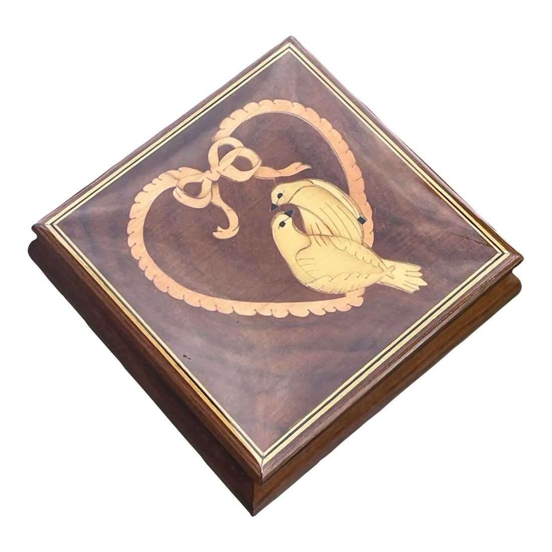 1950s Italian Inlay Musical Box Love Birds: This beautiful Italian music box is a rare find, featuring intricate wood inlay and a charming scene of love birds. The timeless melody of "Somewhere My Love" adds to the romance of this piece, making