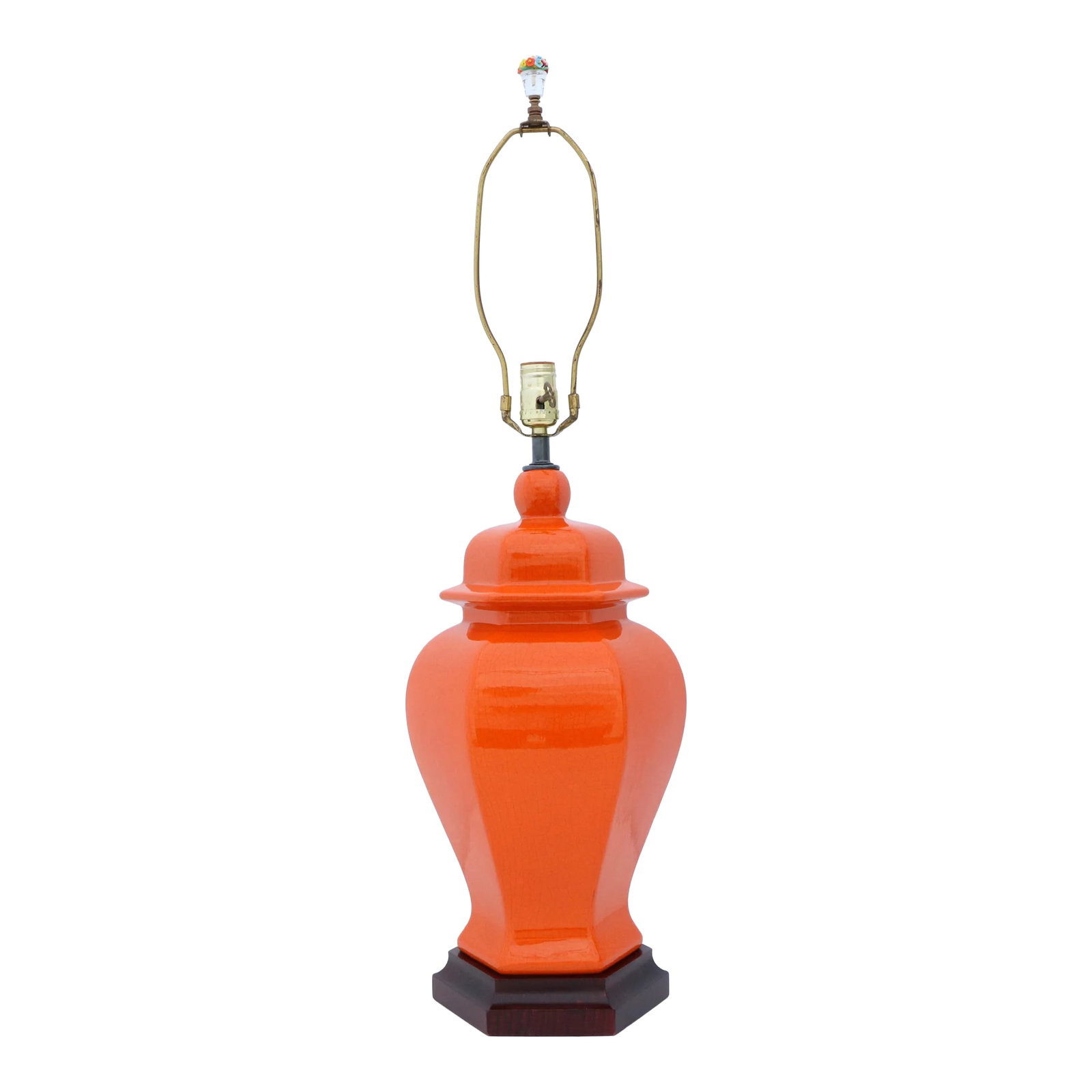 Orange Crackle Glazed Ginger Jar Table Lamp: This vintage lamp features a classic ginger jar form with a vibrant orange crackle finish on a dark wooden base. It measures 33" to the top of its finial, 22.5" tall to the top of its socket, and 10" 
