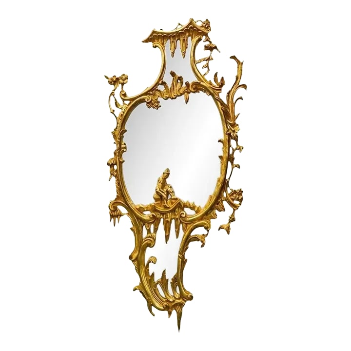 Very large vintage Italian Rococo Chinoiserie Giltwood Mirror: Italian made, large giltwood mirror in the Chinese Chippendale style, measuring 33 by 65 inches, featuring stylized foliate scrolls and rocaille designs and Chinese figure. Condition: Alterations: Unk