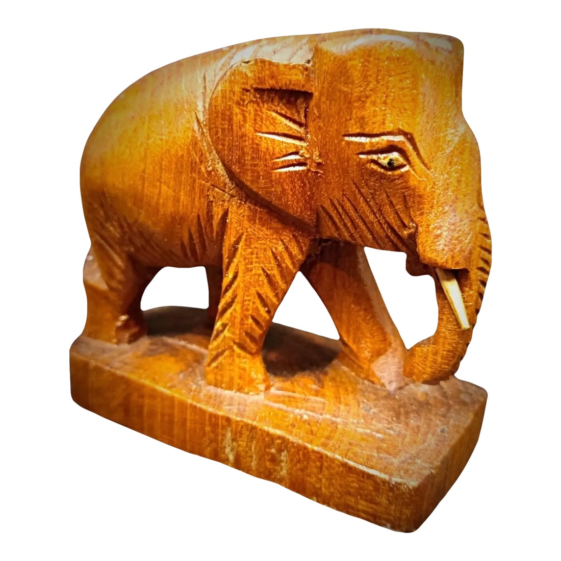 Vintage Rustic Artisan Craft Hand-Carved Wooden Elephant Figurine: Add a touch of rustic charm to your home decor with this petite hand-carved wooden elephant figurine. Perfect for collectors or as a thoughtful gift, this piece showcases the beauty of traditional