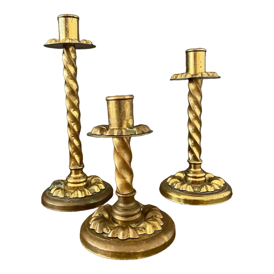 Set of 3 Antique Brass Candle Holder: Beautiful antique brass candle holder set. These stunning candle holders are made of brass and have a very nice raised design on the rim of the very top and very bottom and it twisted on the body.
